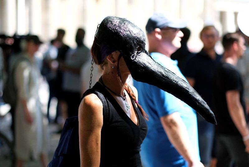 A demonstrator wearing a mask is seen during a protest against the government's restrictions amid the coronavirus disease (COVID-19) outbreak, in Berlin, Germany, August 1, 2020. (Photo by Christian Mang/Reuters)